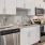 a kitchen with white cabinets