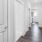 a hallway with white doors