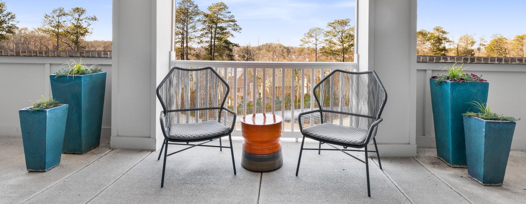 chairs and a table on a deck