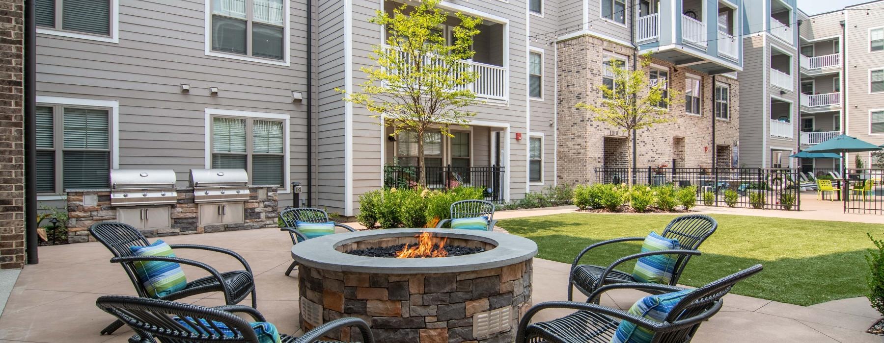 a courtyard with chairs and tables